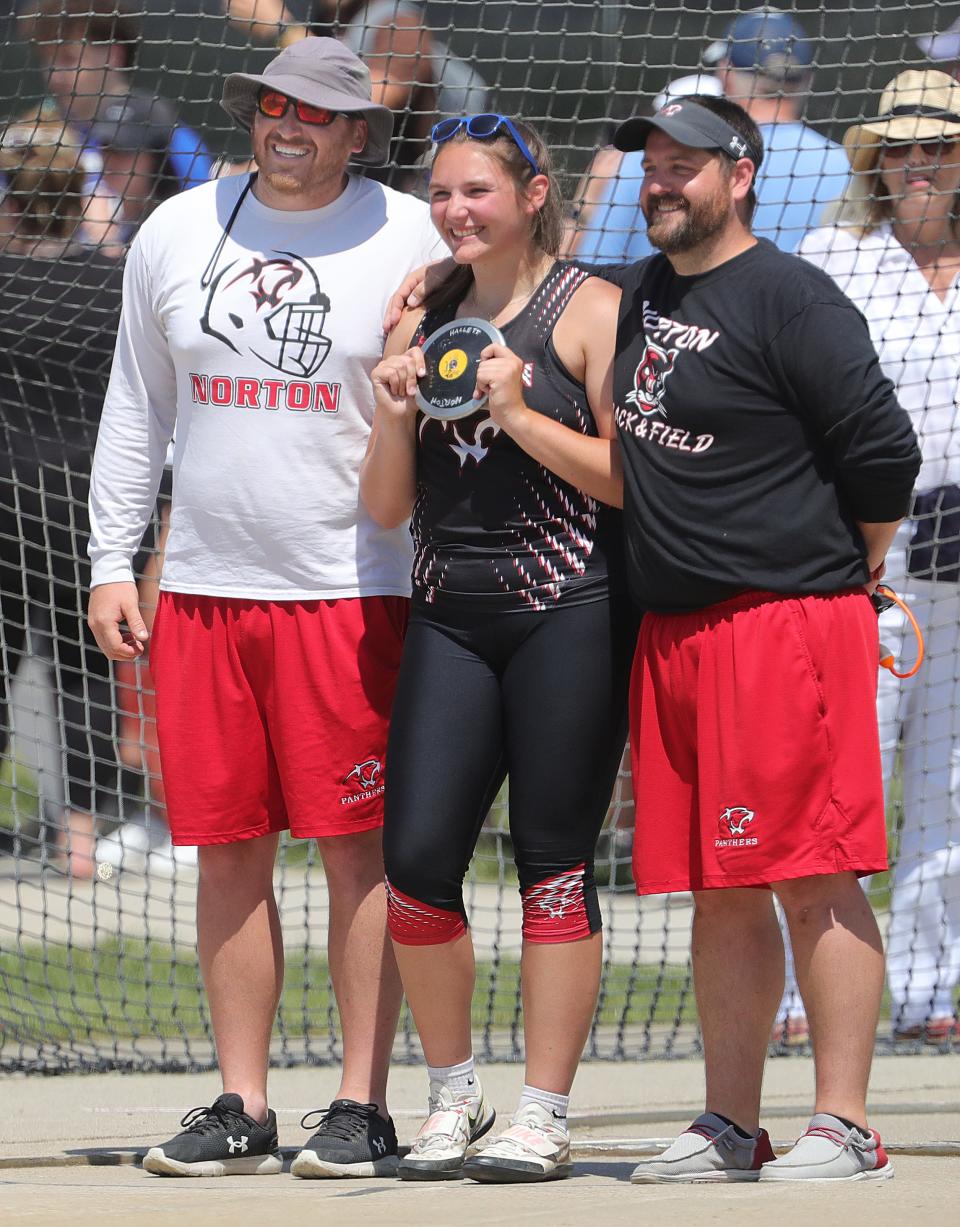 Norton's Morgan Hallett poses for a photo June 2 with coaches Jim Cercek, left, and Kevin Pollock after setting a state record in the OHSAA Division II discus in Columbus.