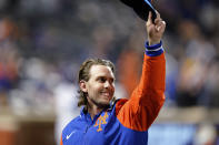 New York Mets' Jeff McNeil gestures to fans during the fourth inning of the team's baseball game against the Washington Nationals on Wednesday, Oct. 5, 2022, in New York. (AP Photo/Frank Franklin II)