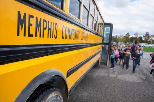 Students board a Memphis Community Schools bus in this Times Herald file photo.