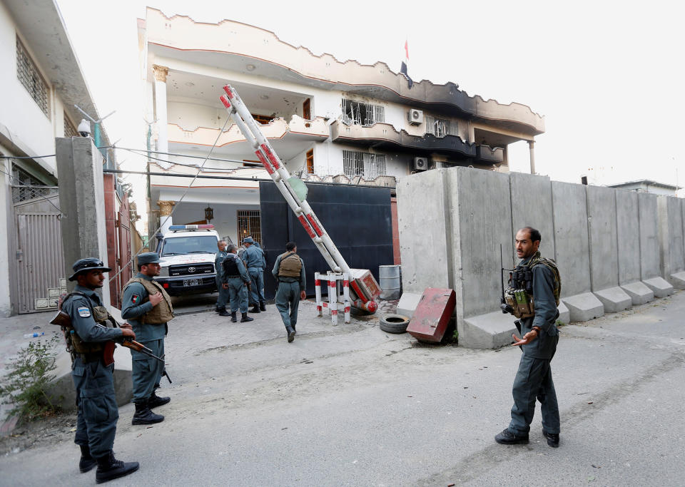 <p>Afghan policemen stand guard outside the Iraqi embassy after an attack in Kabul, Afghanistan July 31, 2017. (Mohammad Ismail/Reuters) </p>