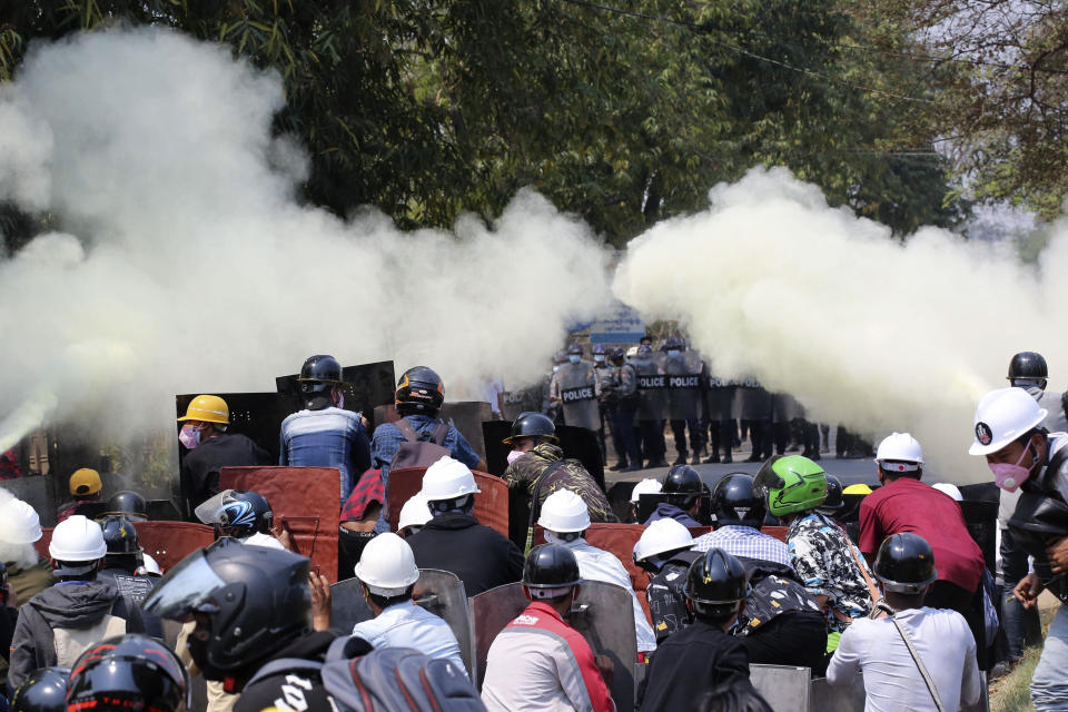 Anti-coup protesters discharge fire extinguishers to counter the impact of the tear gas fired by police during a demonstration in Naypyitaw, Myanmar, Monday, March 8, 2021. The escalation of violence in Myanmar as authorities crack down on protests against the Feb. 1 coup is raising pressure for more sanctions against the junta, even as countries struggle over how to best sway military leaders inured to global condemnation. (AP Photo)