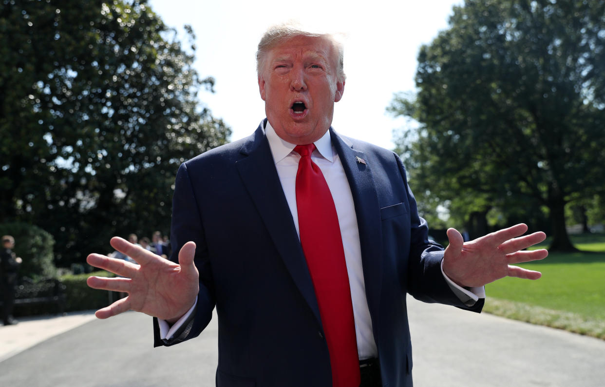 President Trump talks to reporters on the South Lawn of the White House Friday. (Leah Millis/Reuters)