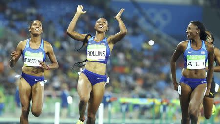 2016 Rio Olympics - Athletics - Final - Women's 100m Hurdles Final - Olympic Stadium - Rio de Janeiro, Brazil - 17/08/2016. Gold medallist Brianna Rollins (USA) of USA (C), silver medallist Nia Ali (USA) of USA (R) and bronze medallist Kristi Castlin (USA) of USA (L) celebrate. REUTERS/Lucy Nicholson