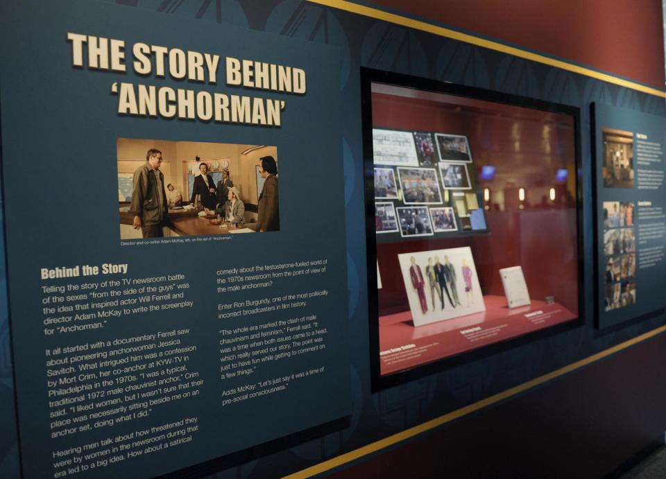Information about the "Anchorman" movie are seen at an exhibit at the Newseum in Washington, Friday, Nov. 15, 2013. The museum about news and the First Amendment has opened "Anchorman: The Exhibit," featuring costumes and props from Will Ferrell's 2004 movie "Anchorman: The Legend of Ron Burgundy." The story of a fictional news team's sexist reaction to the arrival of an ambitious female reporter was a parody of real tumult in the 1970s TV business. (AP Photo/Susan Walsh)