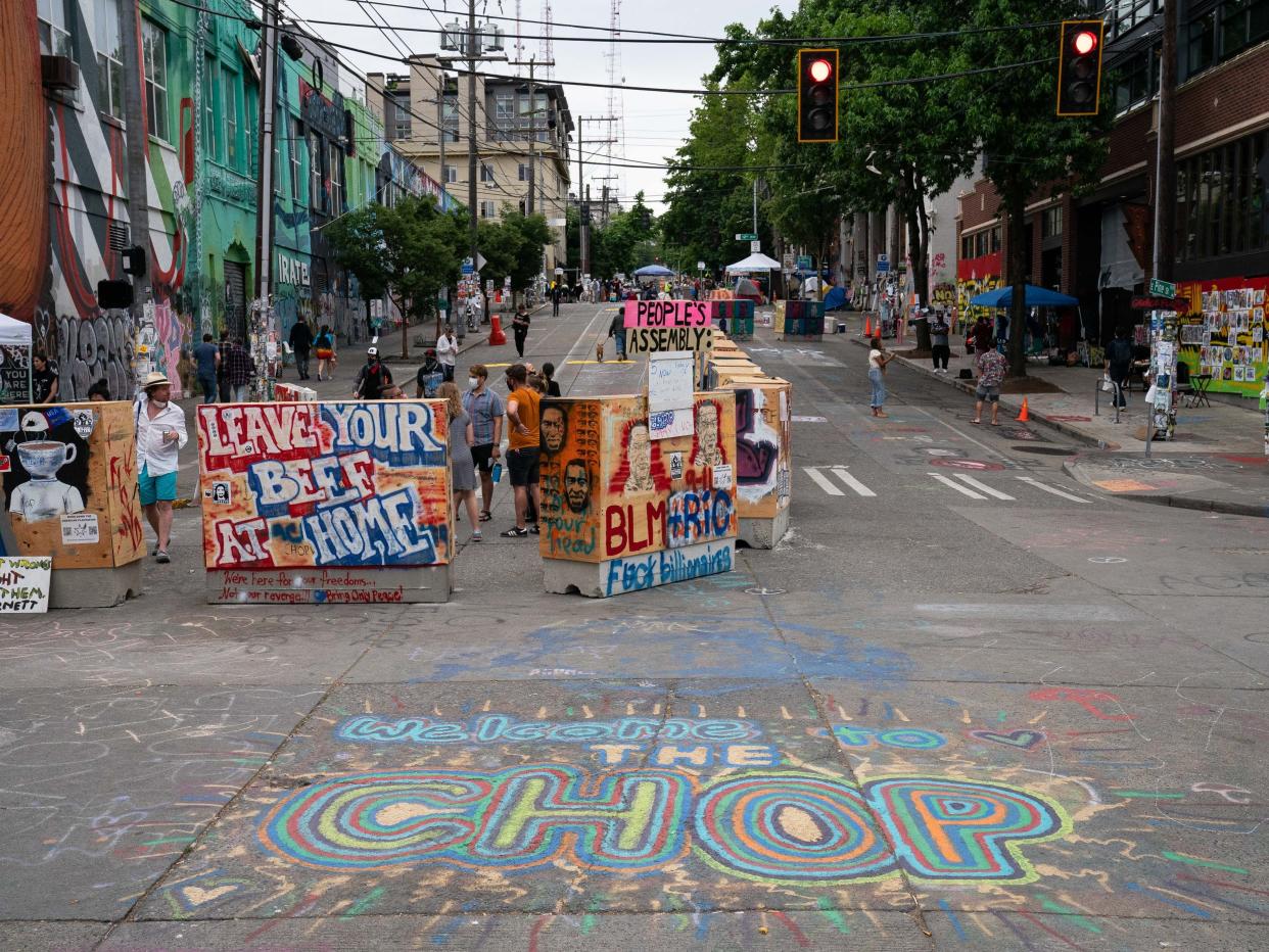 People walk through the area known as the Capitol Hill Organized Protest (CHOP) on June 26, 2020, in Seattle, Washington.