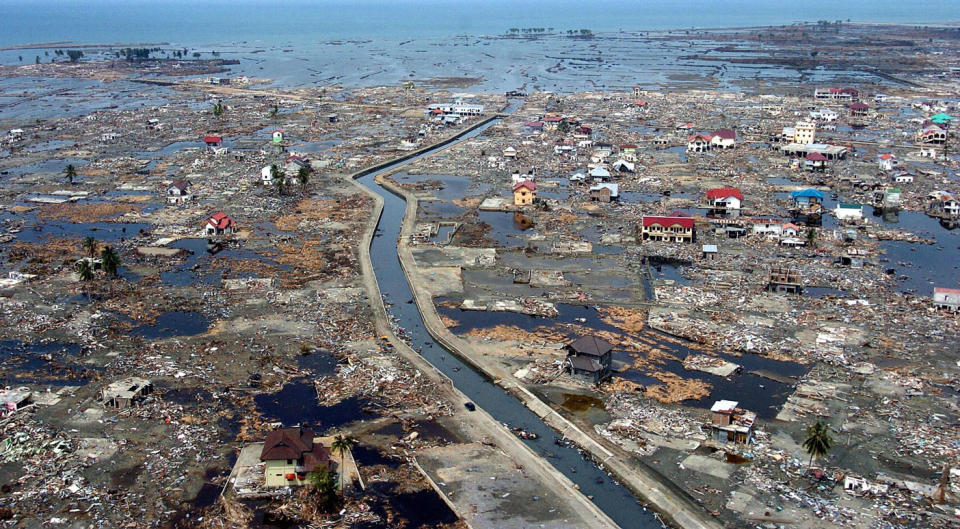 An aerial shot shows flattened houses near the sea coast of Banda Aceh, 05 January 2005. Source: AFP via Getty Images