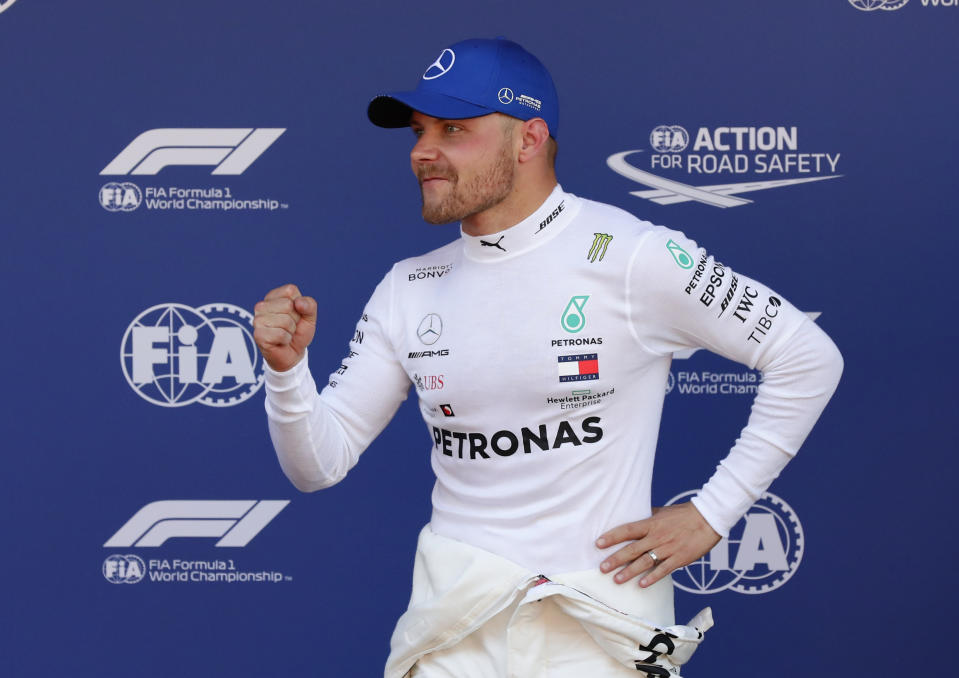 Mercedes driver Valtteri Bottas of Finland celebrates after setting the pole position during the qualifying session at the Barcelona Catalunya racetrack in Montmelo, just outside Barcelona, Spain, Saturday, May 11, 2019. The Formula One race will take place on Sunday. (AP Photo/Manu Fernandez)