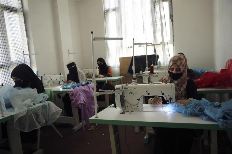 Afghan women tailors work with a sewing machine in the Afghan Women Business Hub in Kabul, Afghanistan, Tuesday, July 2, 2024. Half of Afghanistan's population now finds itself locked out of the freedom to work at a time when the country's economy is worse than ever, with few jobs available to women in the country. (AP Photo/Siddiqullah Alizai)