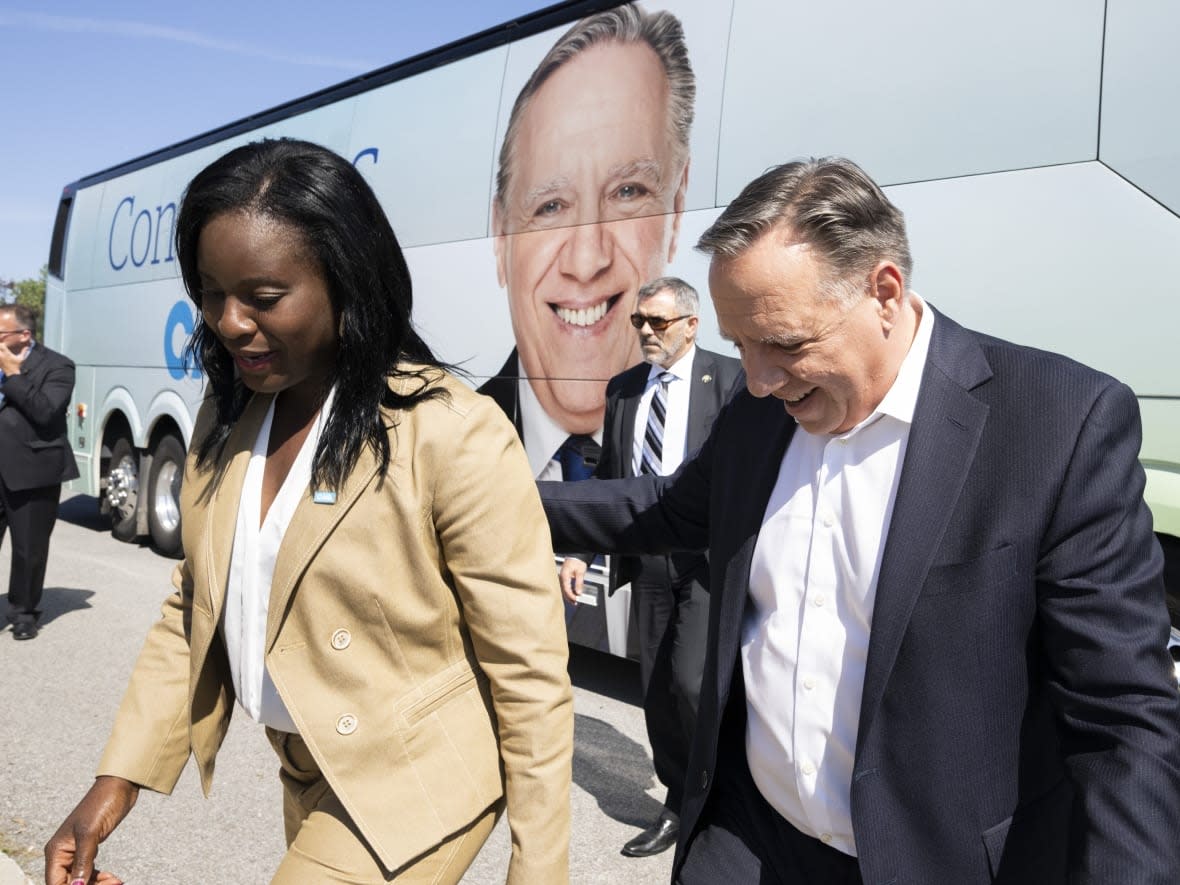 François Legault campaigned in Laval's Mille-Îles riding on Monday alongside candidate Julie Séide. The Coalition Avenir Québec is looking to grab more of the city's six seats. (Paul Chiasson/The Canadian Press - image credit)
