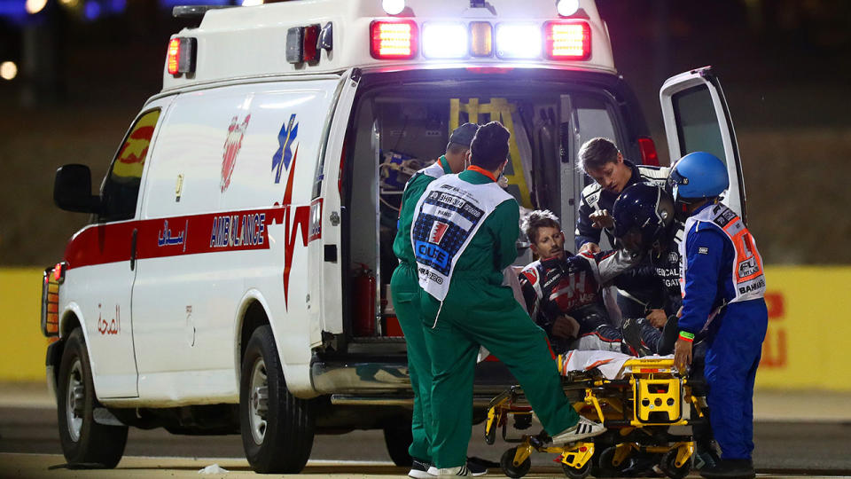 Romain Grosjean, pictured here being helped into an ambulance.