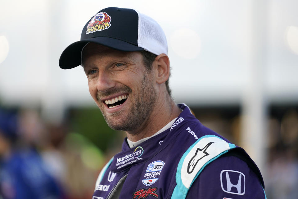 Romain Grosjean (51) smiles before the start an IndyCar auto race at World Wide Technology Raceway on Saturday, Aug. 21, 2021, in Madison, Ill. (AP Photo/Jeff Roberson)