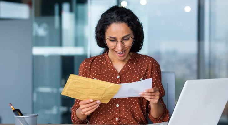 A woman receiving her bonus from her annuity