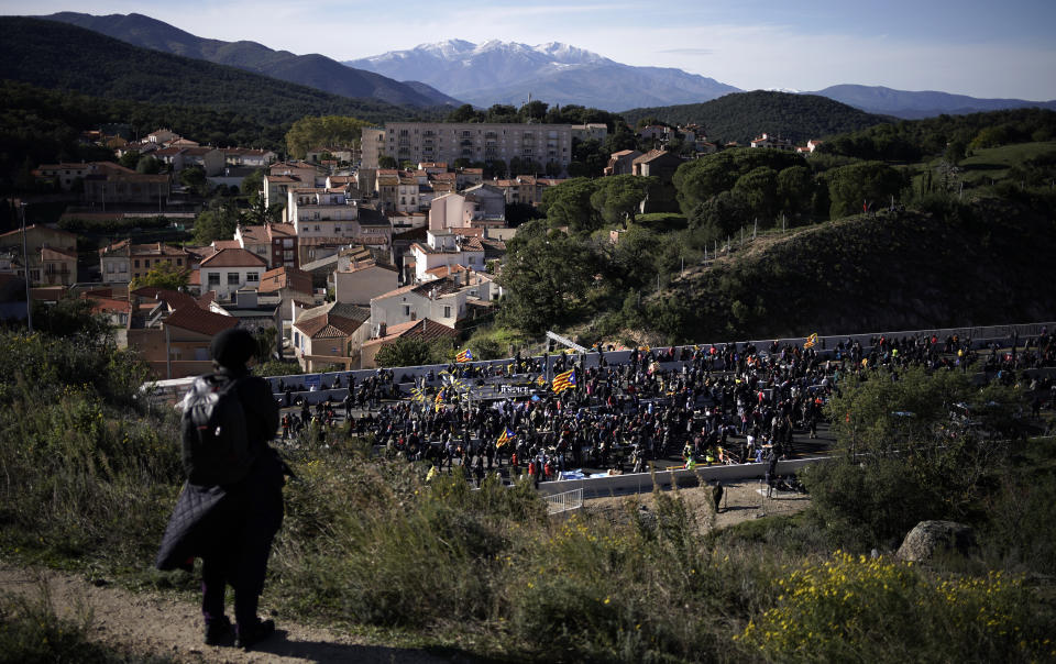 Pro-Catalan independence demonstrators block a major highway border pass near La Jonquera between Spain and France, Monday, Nov. 11, 2019. Protesters following a call to action by a secretive pro-Catalan independence group have closed off both sides of the AP7 highway at the major transportation hub of La Jonquera between France and Spain. (AP Photo/Felipe Dana)