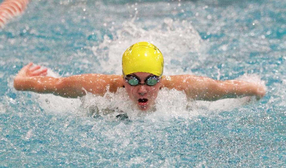 Firestone's Katie Miller swims to a first-place finish in a meet-record 55 seconds in the 100-yard butterfly during the Canton City Schools Christmas Invitational meet in 2012 at Canton's C.T. Branin Natatorium.