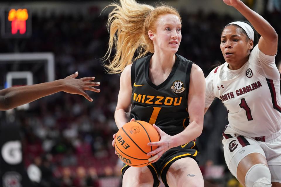 Missouri guard Luraen Hansen, left, drives to the hoop against South Carolina guard Zia Cooke, right, during the first half of an NCAA college basketball game, Sunday, Jan. 15, 2023, in Columbia, S.C. (AP Photo/Sean Rayford)