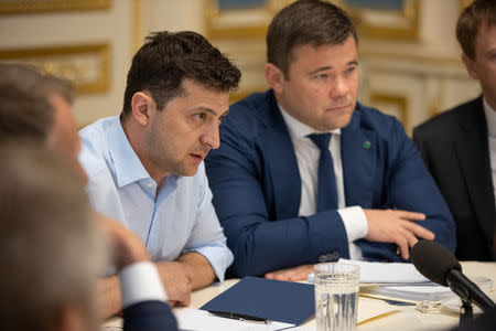 President of Ukraine Volodymyr Zelenskiy (L) and his lawyer and adviser Andriy Bogdan (R) attend a meeting with lawmakers in Kiev, Ukraine May 21, 2019. Ukrainian Presidential Press Service/Handout via REUTERS