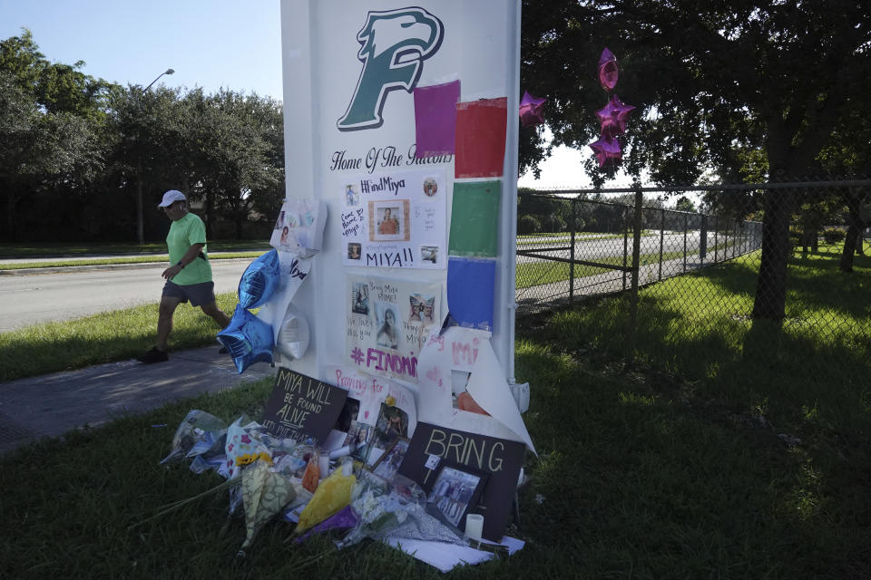 Flowers adorn a memorial for slain college student Miya Marcano at Flanagan High School in Pembroke Pines, Fla., Monday, Oct. 4, 2021. Authorities say they've found the body of a missing Florida college student who disappeared a week ago. Orange County Sheriff John Mina said Saturday, Oct. 2, that authorities found Miya Marcano’s body near an apartment building. (Joe Cavaretta/South Florida Sun-Sentinel via AP)