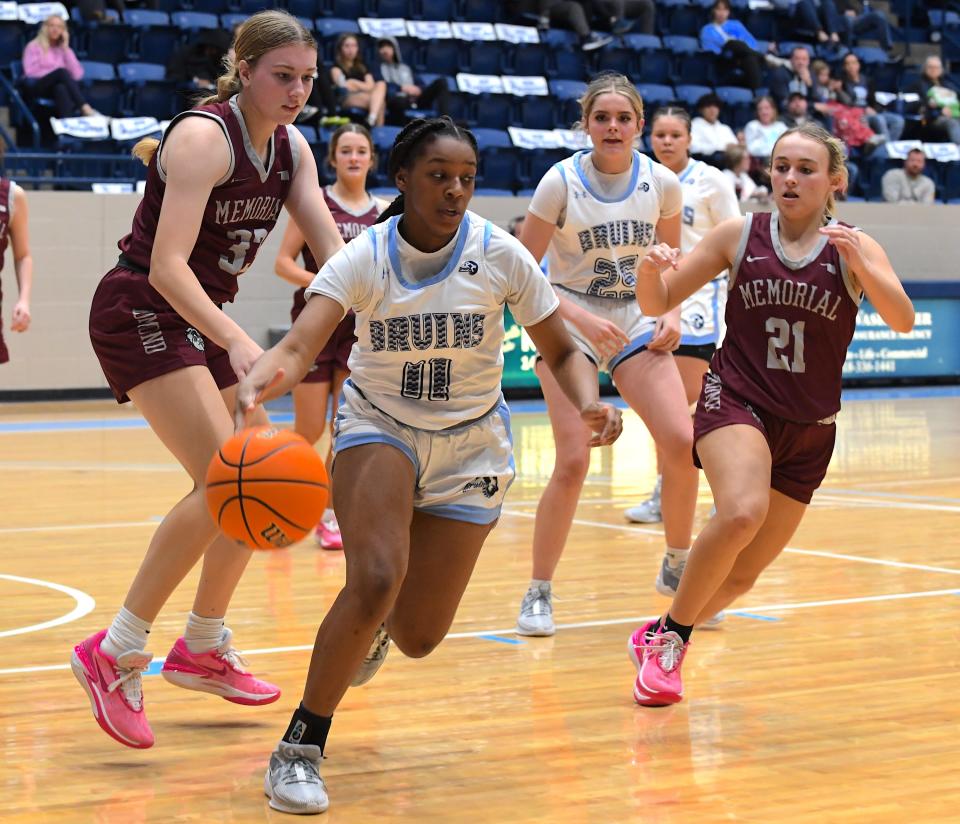 Bartlesville High School's Cadence Gray chases down a loose ball during basketball action against Edmond Memorial in Bartlesville on Dec. 19, 2023.