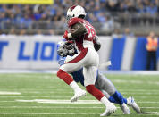 <p>Arizona Cardinals cornerback Justin Bethel (28) breaks a tackle after intercepting a Detroit Lions quarterback Matthew Stafford pass for an 82-yard touchdown during the first quarter of an NFL football game in Detroit, Sunday, Sept. 10, 2017. (AP Photo/Jose Juarez) </p>