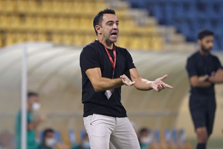 Xavi Hernández en su experiencia como DT en Qatar (Photo by KARIM JAAFAR / AFP)