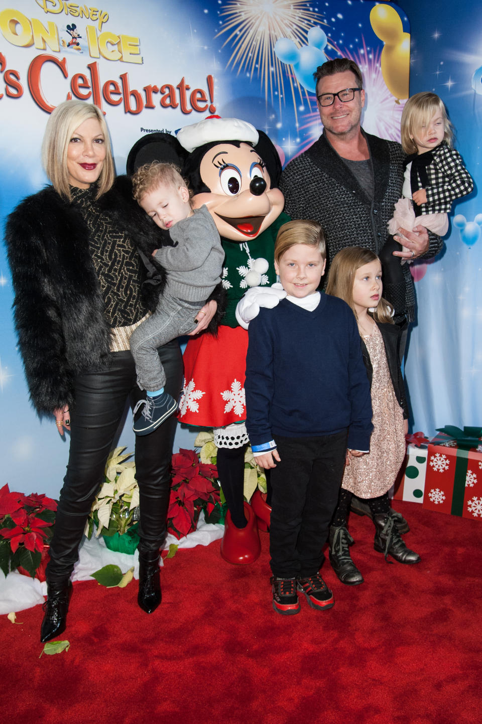 Tori Spelling, Dean McDermott and their children Finn Davey McDermott, Hattie Margaret McDermott, Stella Doreen McDermott and Liam Aaron McDermott attend the Disney On Ice Presents Let's Celebrate! on Thursday, Dec. 11, 2014, in Los Angeles. (Photo by Richard Shotwell/Invision/AP)