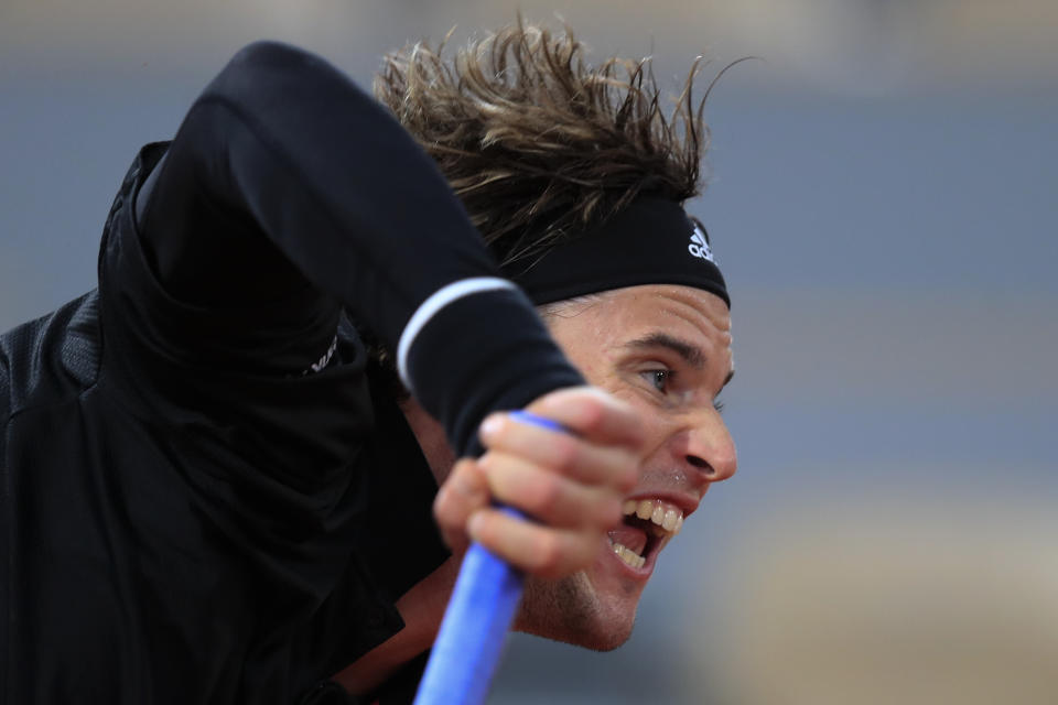 Austria's Dominic Thiem plays a shot against Norway's Casper Ruud in the third round match of the French Open tennis tournament at the Roland Garros stadium in Paris, France, Friday, Oct. 2, 2020. (AP Photo/Michel Euler)