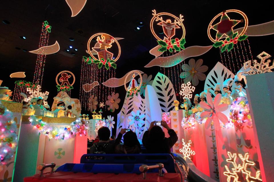 Lighted holiday signs decorate a ride