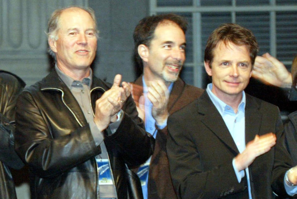 Frank Marshall and Michael J Fox at the launch party of the 'Back to the Future' DVD in 2002 - Credit: Getty Images