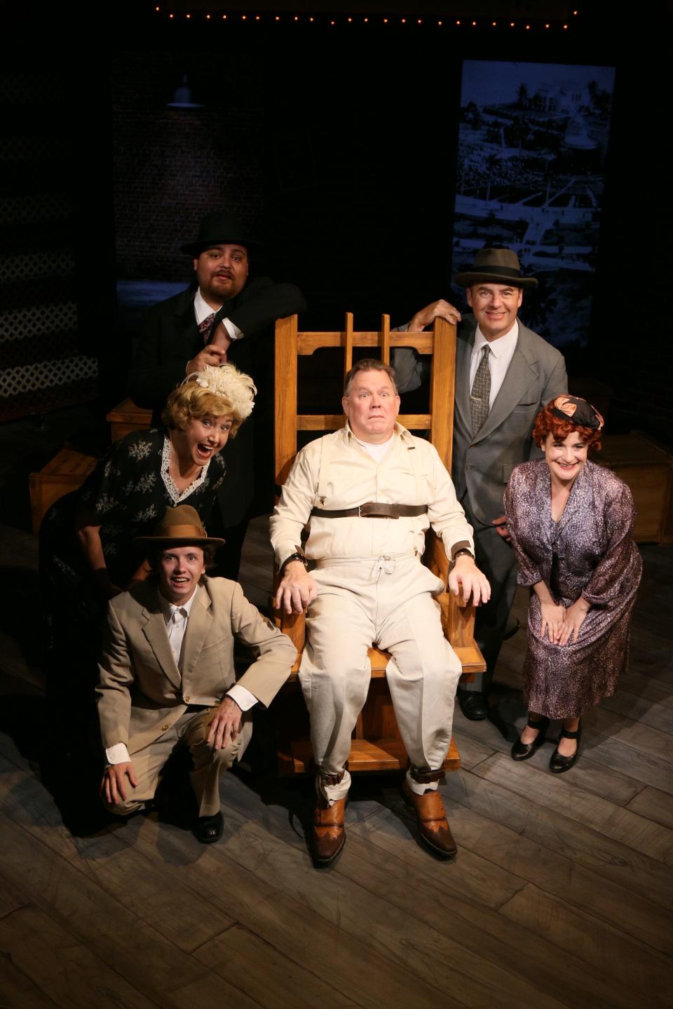 Alan Selby, center, plays "Giuseppe Zangara," surrounded by members of the ensemble of the musical "Assassins," on stage at Melbourne Civic Theatre through Sept. 11, 2022. Visit mymct.org.