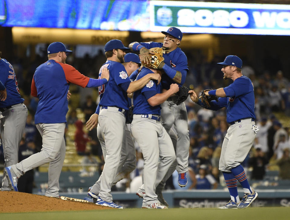 The Chicago Cubs celebrate a combined no-hitter after the final out by relief pitcher Craig Kimbrel in a baseball game against the Los Angeles Dodgers in Los Angeles, Thursday, June 24, 2021. The Cubs won 4-0. (AP Photo/Kelvin Kuo)