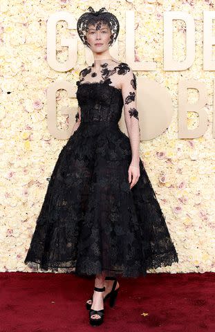 <p>Kevin Mazur/Getty </p> Rosamund Pike attends the 81st Annual Golden Globe Awards at The Beverly Hilton on January 07, 2024