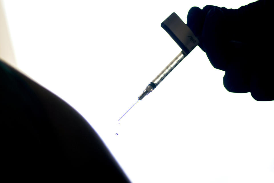 FILE - In this Dec. 15, 2020, file photo, a droplet falls from a syringe after a person was injected with the Pfizer COVID-19 vaccine at a hospital in Providence, R.I. (AP Photo/David Goldman, File)