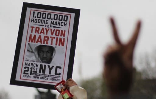 Supporters of Trayvon Martin, a black teenager shot dead while unarmed by a neighborhood watch captain, rally in New York City. The police chief at the center of a growing storm in the United States over the fatal shooting of an unarmed black teenager by a white crime watch volunteer stepped down temporarily Thursday