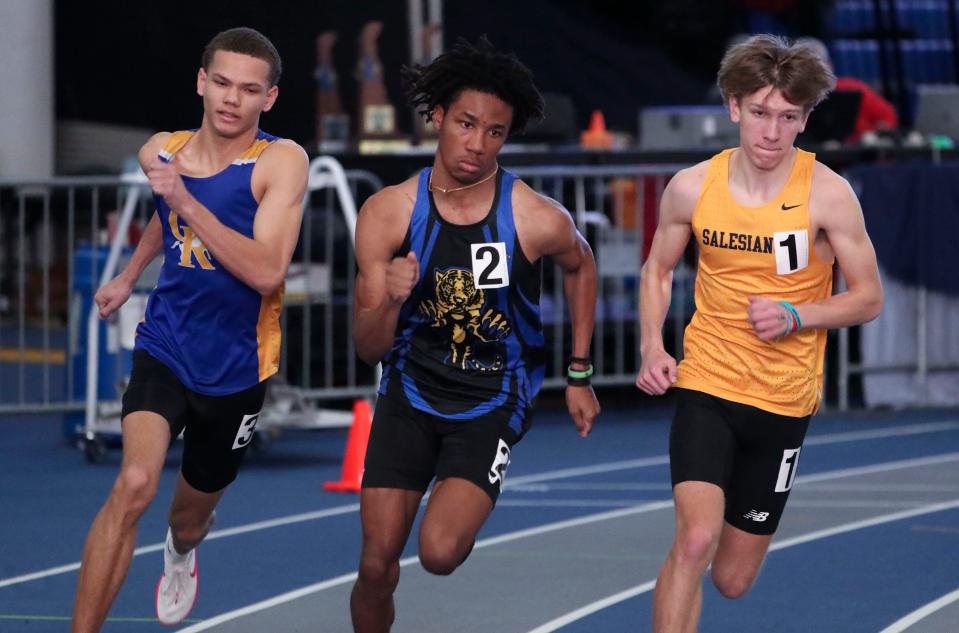 Salesianum's Ethan Walther (right) runs to a first place finish in the 800 meter run ahead of second place A.I. du Pont's Camerin Williams (center) and third place Ian Cain of Caesar Rodney during the DIAA indoor track and field championships at the Prince George's Sports and Learning Complex in Landover, Md., Saturday, Feb. 3, 2024.