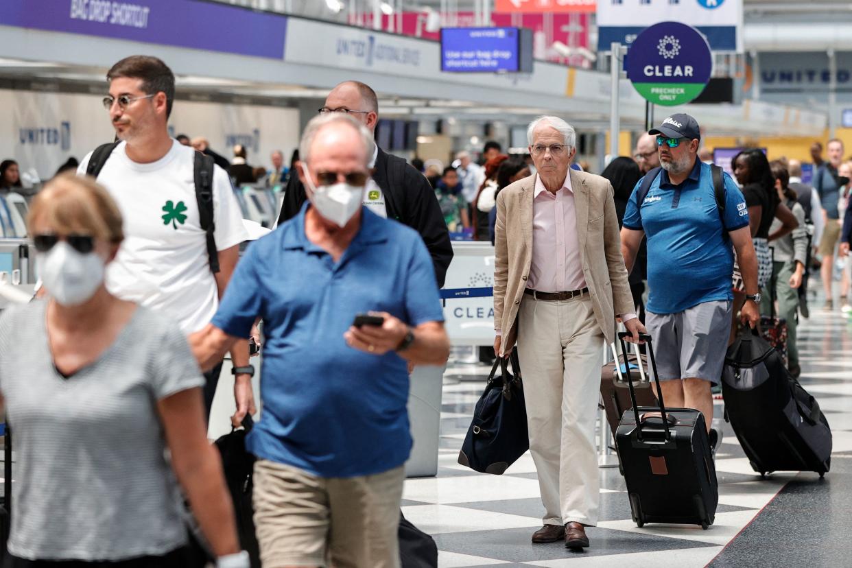 Travelers arrive at O'Hare International Airport on June 30, 2022 in Chicago. (Photo by KAMIL KRZACZYNSKI/AFP)