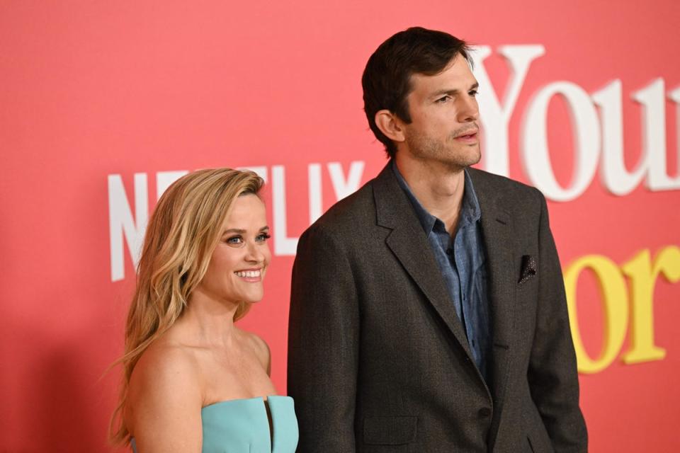 Reese Witherspoon and Ashton Kutcher pose together at the world premiere for their new romcom Your Place Or Mine in Los Angeles (AFP via Getty Images)