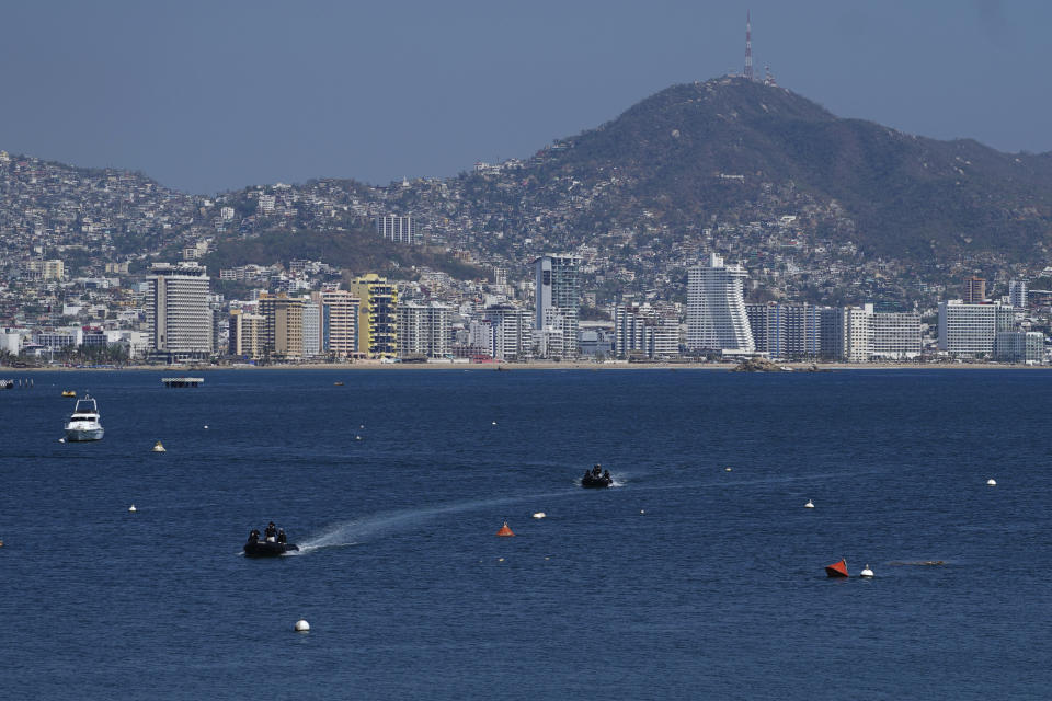 Members of the Navy and the Urgent Medical Rescue Squadron (ERUM) dive in search of bodies, weeks after the passing of Hurricane Otis, in Acapulco, Mexico, Saturday, Nov. 11, 2023. It was 12:20 a.m. on Oct. 25. when Hurricane Otis made landfall in this Pacific port city as a Category 5 hurricane, leaving 48 dead, mostly by drowning, and 31 missing, according to official figures. Sailors, fishermen and relatives of crew members believe that there may be more missing because sailors often go to take care of their yachts when a storm approaches. (AP Photo/Marco Ugarte)