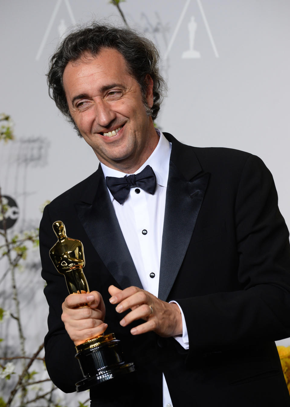 Paolo Sorrentino poses in the press room with the award for best foreign language film of the year for "The Great Beauty" during the Oscars at the Dolby Theatre on Sunday, March 2, 2014, in Los Angeles. (Photo by Jordan Strauss/Invision/AP)