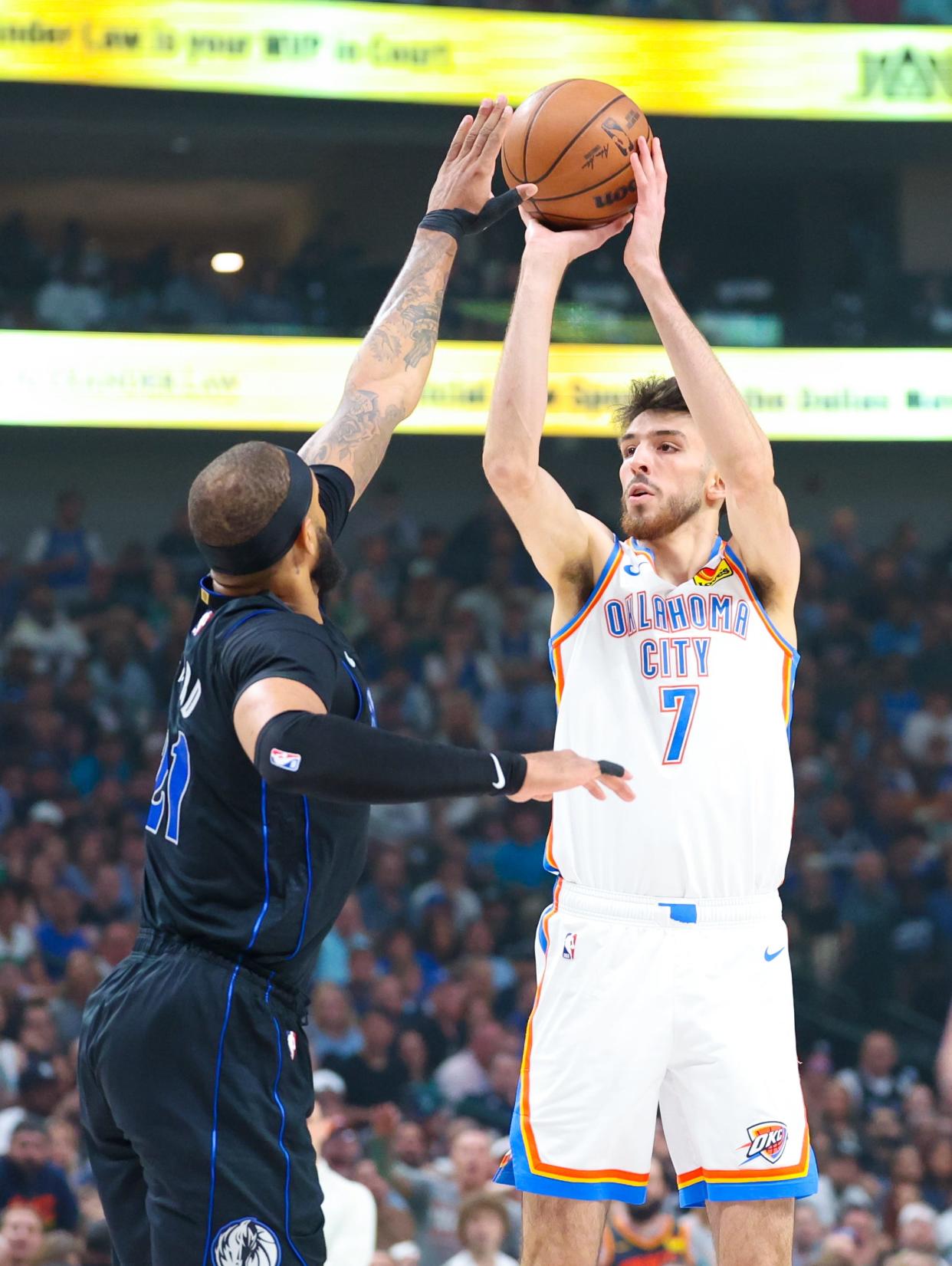 May 18, 2024; Dallas, Texas, USA; Oklahoma City Thunder forward Chet Holmgren (7) shoots over Dallas Mavericks center Daniel Gafford (21) during the first quarter in game six of the second round of the 2024 NBA playoffs at American Airlines Center.
