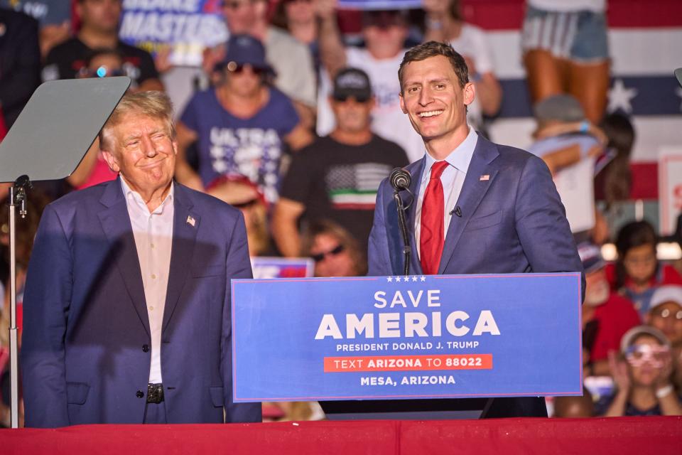 U.S. Senate candidate Blake Masters, after being invited back on stage, gives remarks and praises former President Donald Trump during Trump's rally at Legacy Sports Park in Mesa on Sunday, Oct. 9, 2022.