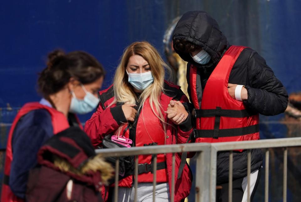 A group thought to be migrants are brought in to Dover from a Border Force vessel (Gareth Fuller/PA) (PA Wire)