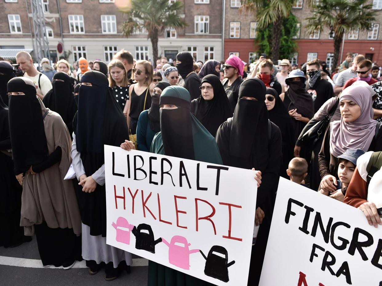 Women protest in Copenhagen on the first day of the implementation of the Danish face veil ban: EPA