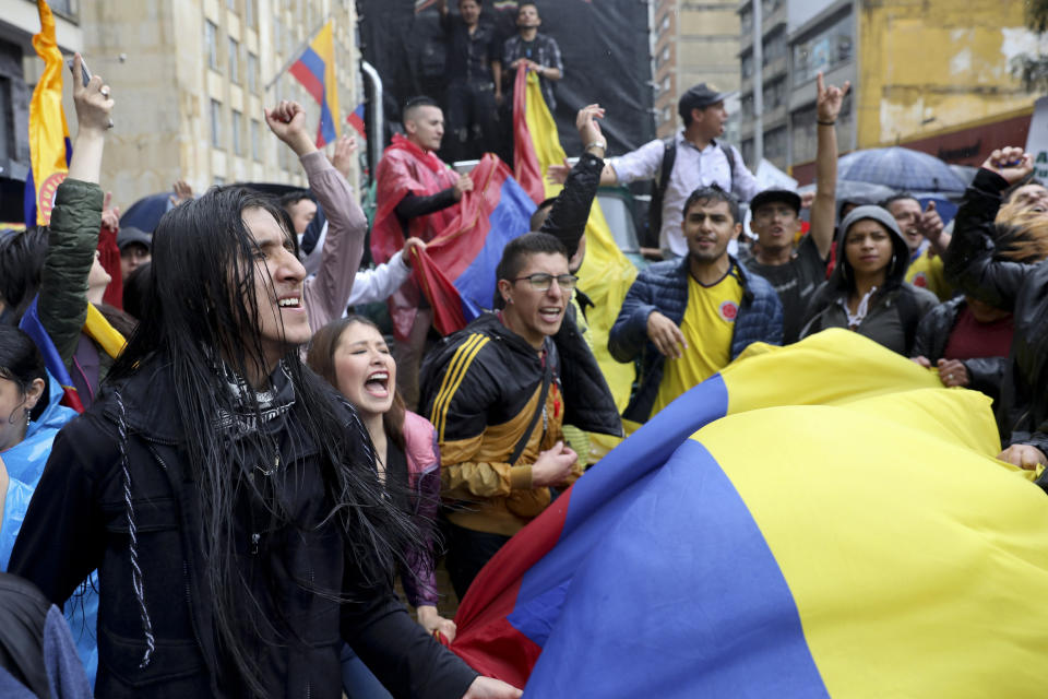Students rally during a nationwide strike at the Bolivar square in downtown Bogota, Colombia, Thursday, Nov. 21, 2019. Colombia's main union groups and student activists called for a strike to protest the economic policies of Colombian President Ivan Duque government and a long list of grievances. (AP Photo/Fernando Vergara)