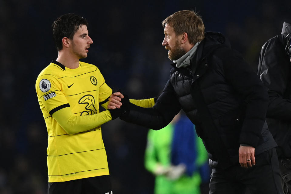 Brighton manager Graham Potter shakes hands with Chelsea midfielder Mason Mount.