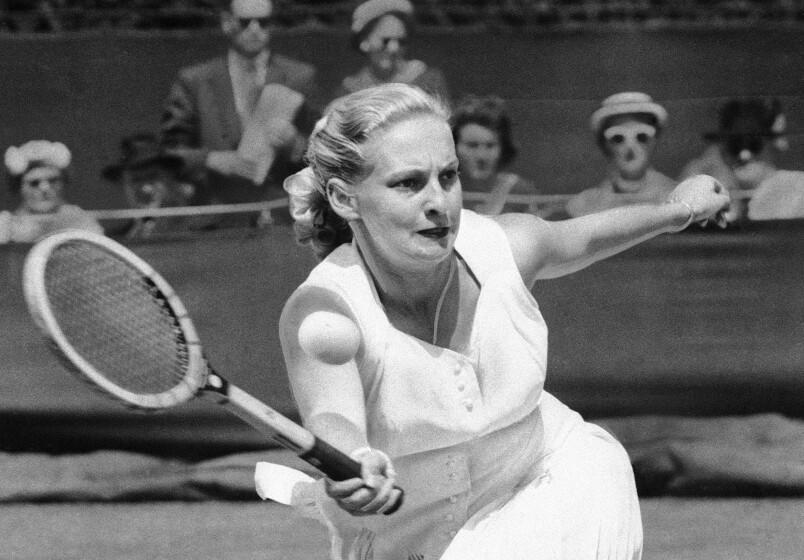 FILE - Darlene Hard hits a forehand to Zsuzsa Kormoczy during a quarterfinal on June 28, 1955.