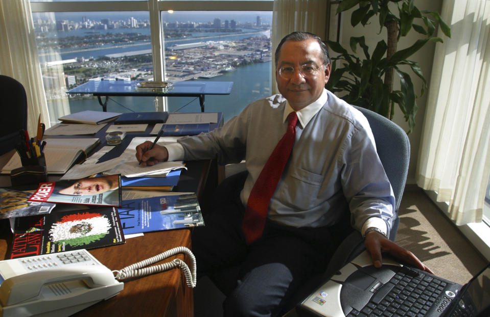 Manuel Rocha sits in his office at Steel Hector & Davis in Miami in January 2003, joining the firm to help open doors in Latin America. Long before Rocha, a former U.S. diplomat, was arrested in 2023 on charges of being a secret agent of Cuba for decades, there were plenty of red flags. An Associated Press investigation found the CIA received a tip about his alleged double life as far back as 2006, that Rocha may have been on a short list of suspected spies since 2010 and could have been linked to intelligence from 1987 of a U.S. turncoat known as Fidel Castro’s “super mole.” (Raul Rubiera/Miami Herald via AP)