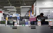 A shopper looks at Sony Corp's Vaio PCs at an electronics retail store in Tokyo February 5, 2014. REUTERS/Yuya Shino