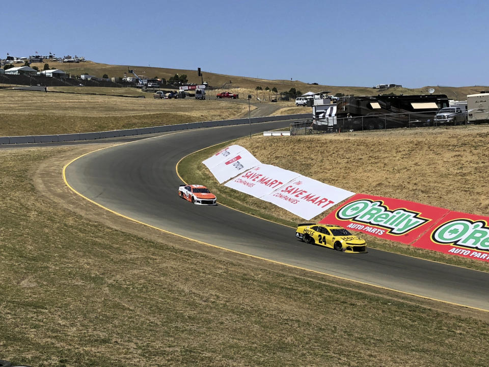 Daniel Hemric (8) and William Byron (24) drive into "The Carousel" at Sonoma Raceway during a NASCAR Cup Series practice Friday, June 21, 2019 in Sonoma, Calif. The track has put the tricky carousel turn back into its layout for the first time since 1997. (AP Photo/Greg Beacham)