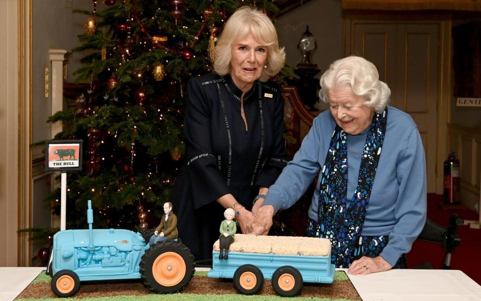 Queen Camilla, pictured with June Spencer, who played Peggy Woolley in the show, has said she’s an Archers fan - PA