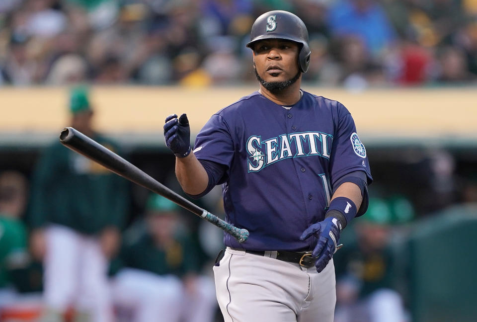 OAKLAND, CA - MAY 24:  Edwin Encarnacion #10 of the Seattle Mariners reacts tossing his bat away after striking out against the Oakland Athletics in the top of the second inning of a Major League Baseball game at Oakland-Alameda County Coliseum on May 24, 2019 in Oakland, California.  (Photo by Thearon W. Henderson/Getty Images)